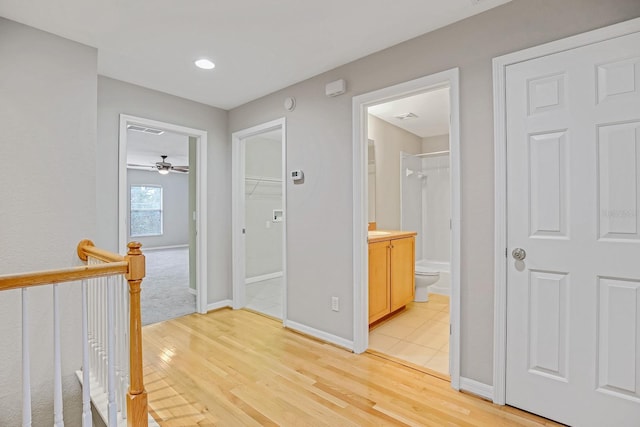 16137 Churchview Dr, Lithia, FL 33547 - corridor featuring light wood finished floors, baseboards, and recessed lighting