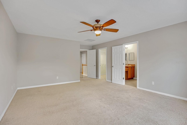 16137 Churchview Dr, Lithia, FL 33547 - unfurnished bedroom featuring baseboards, light colored carpet, and a walk in closet