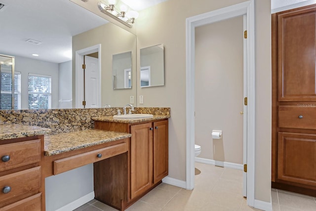 16137 Churchview Dr, Lithia, FL 33547 - full bathroom featuring vanity, toilet, tile patterned flooring, and baseboards