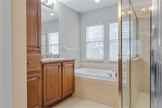 16137 Churchview Dr, Lithia, FL 33547 - full bathroom featuring vanity, a shower stall, a bath, and tile patterned floors