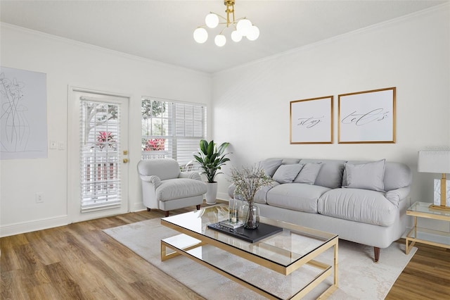 800 S Dakota Ave Unit 204, Tampa, FL 33606 - living area featuring wood finished floors, a chandelier, crown molding, and baseboards