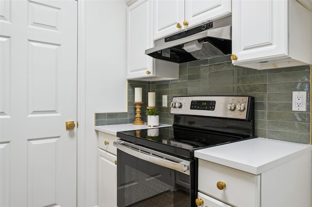 800 S Dakota Ave Unit 204, Tampa, FL 33606 - kitchen featuring electric range, under cabinet range hood, tasteful backsplash, and white cabinets