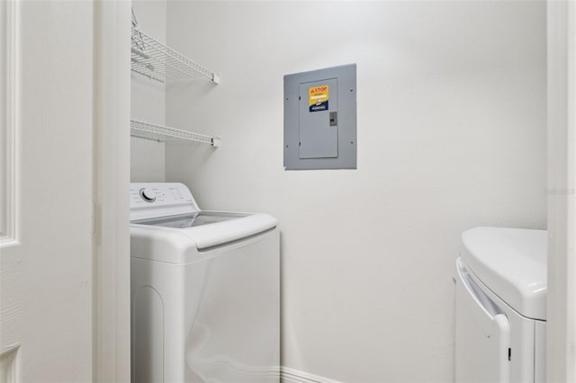 800 S Dakota Ave Unit 204, Tampa, FL 33606 - laundry room with electric panel and washing machine and dryer