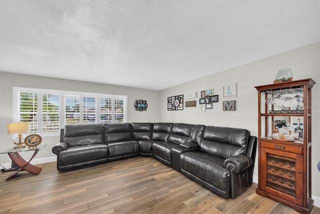 9591 Commodore Dr, Seminole, FL 33776 - living area featuring wood finished floors and baseboards