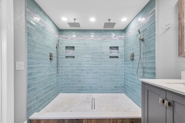 9591 Commodore Dr, Seminole, FL 33776 - bathroom with vanity, tiled shower, and recessed lighting