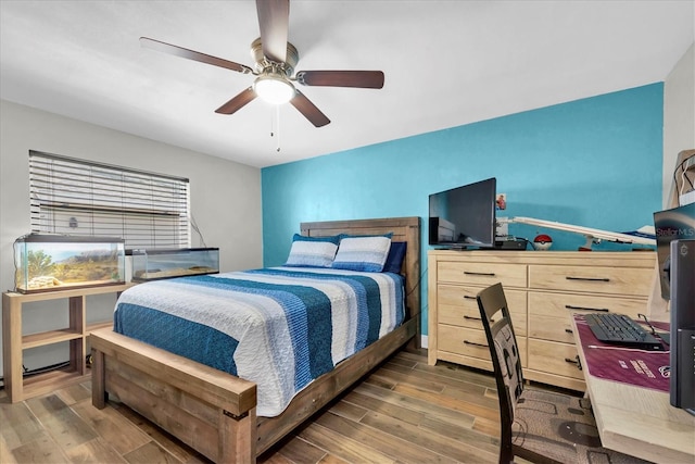 9591 Commodore Dr, Seminole, FL 33776 - bedroom with wood finished floors and a ceiling fan
