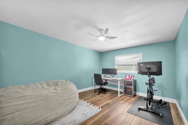 9591 Commodore Dr, Seminole, FL 33776 - office space featuring wood finished floors, ceiling fan, and baseboards