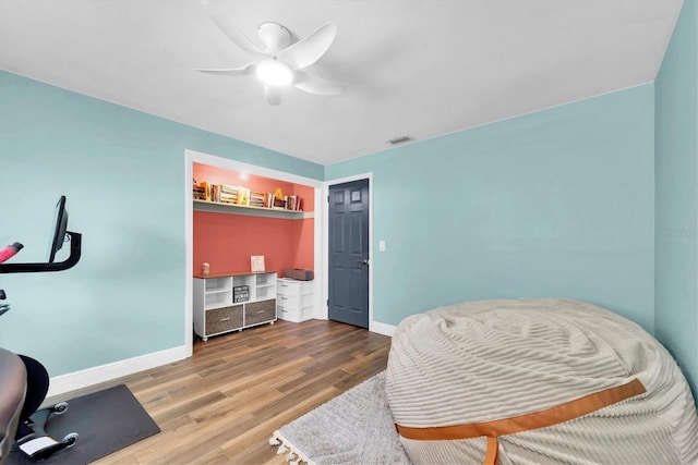 9591 Commodore Dr, Seminole, FL 33776 - home office with wood finished floors, baseboards, and ceiling fan