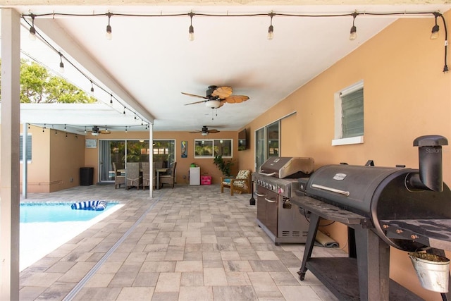 9591 Commodore Dr, Seminole, FL 33776 - view of patio / terrace featuring ceiling fan, outdoor dining area, an outdoor pool, and area for grilling