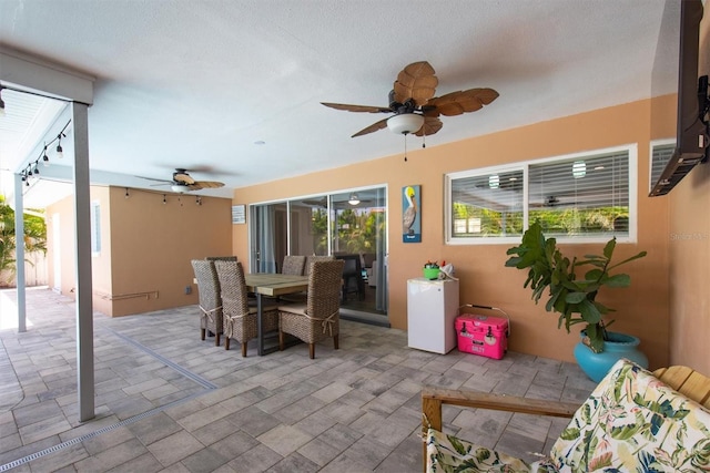9591 Commodore Dr, Seminole, FL 33776 - view of patio / terrace with ceiling fan and outdoor dining area