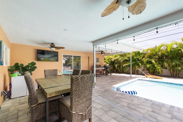 9591 Commodore Dr, Seminole, FL 33776 - outdoor pool with ceiling fan, outdoor dining area, a patio, and area for grilling