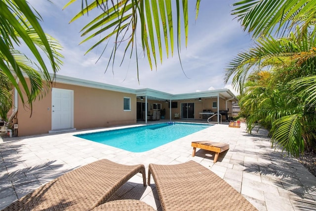 9591 Commodore Dr, Seminole, FL 33776 - swimming pool with ceiling fan and a patio area