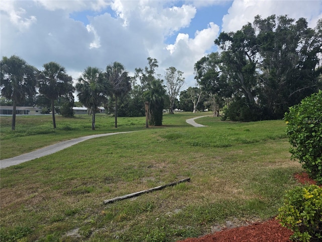9591 Commodore Dr, Seminole, FL 33776 - view of community featuring a lawn