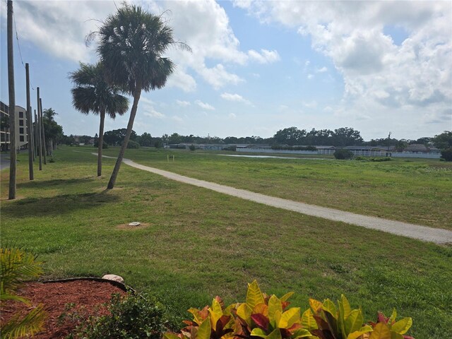 9591 Commodore Dr, Seminole, FL 33776 - view of home's community with a water view and a lawn