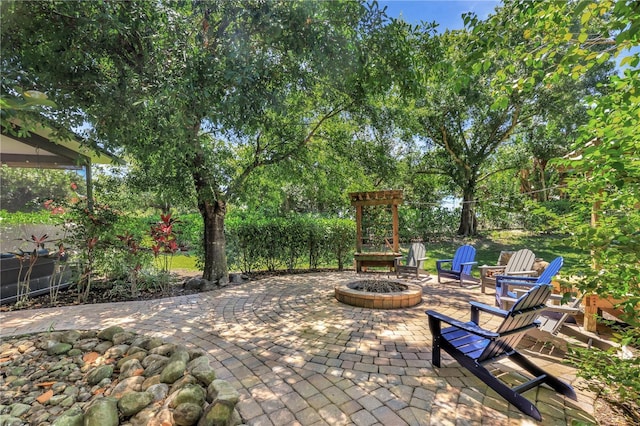 1817 Piccadilly Cir, Cape Coral, FL 33991 - view of patio / terrace with a fire pit