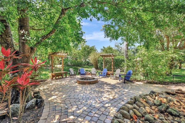 1817 Piccadilly Cir, Cape Coral, FL 33991 - view of patio / terrace featuring a fire pit