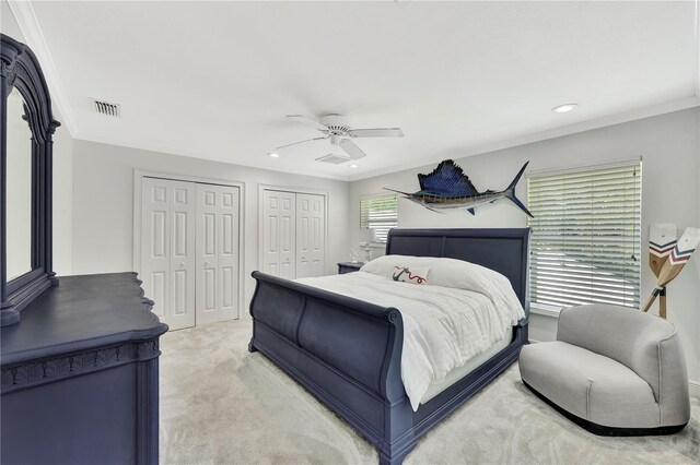 1817 Piccadilly Cir, Cape Coral, FL 33991 - bedroom with multiple closets, light colored carpet, recessed lighting, a ceiling fan, and ornamental molding