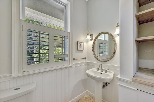 1817 Piccadilly Cir, Cape Coral, FL 33991 - half bath featuring toilet, wainscoting, and a sink