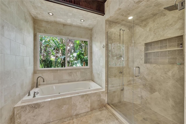 1817 Piccadilly Cir, Cape Coral, FL 33991 - bathroom with a tub with jets, a stall shower, and tile walls