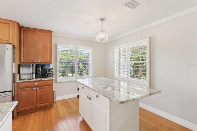 3966 High Bluff Dr, Largo, FL 33770 - kitchen featuring freestanding refrigerator, light wood-type flooring, a chandelier, baseboards, and ornamental molding