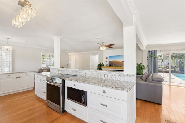 3966 High Bluff Dr, Largo, FL 33770 - kitchen with open floor plan, stainless steel electric stove, ornamental molding, light wood-type flooring, and a ceiling fan