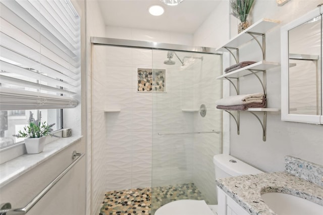 3966 High Bluff Dr, Largo, FL 33770 - bathroom with vanity, toilet, and a stall shower