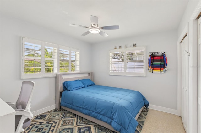 3966 High Bluff Dr, Largo, FL 33770 - bedroom featuring baseboards, a closet, and a ceiling fan