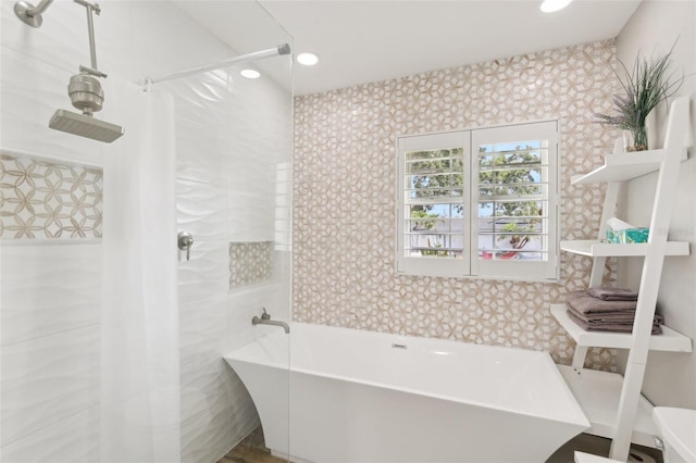 3966 High Bluff Dr, Largo, FL 33770 - bathroom with a soaking tub, wallpapered walls, and recessed lighting