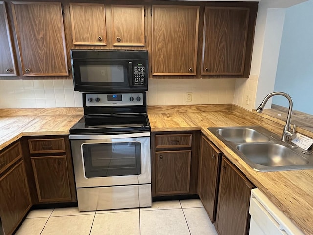4309 Cedar Grove St, Holiday, FL 34691 - kitchen featuring black microwave, stainless steel electric range oven, a sink, decorative backsplash, and dishwasher