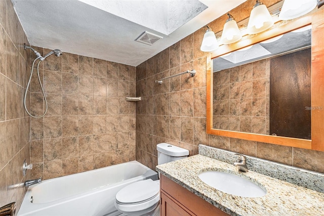 4309 Cedar Grove St, Holiday, FL 34691 - full bath featuring vanity, toilet, shower / tub combination, and tile walls