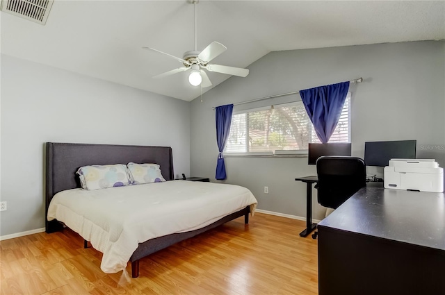 11641 Branch Mooring Dr, Tampa, FL 33635 - bedroom featuring light wood finished floors, vaulted ceiling, baseboards, a desk, and a ceiling fan