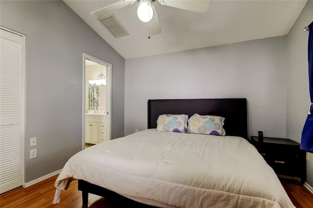11641 Branch Mooring Dr, Tampa, FL 33635 - bedroom with wood finished floors, vaulted ceiling, baseboards, ensuite bathroom, and ceiling fan