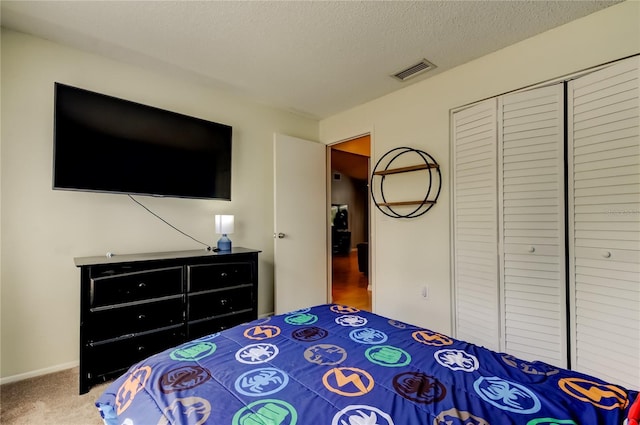 11641 Branch Mooring Dr, Tampa, FL 33635 - carpeted bedroom featuring a closet and a textured ceiling