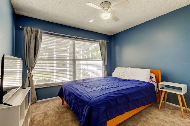 11641 Branch Mooring Dr, Tampa, FL 33635 - carpeted bedroom with multiple windows, baseboards, a textured ceiling, and ceiling fan