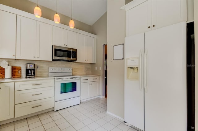 11641 Branch Mooring Dr, Tampa, FL 33635 - kitchen featuring white appliances, light countertops, tasteful backsplash, light tile patterned floors, and hanging light fixtures