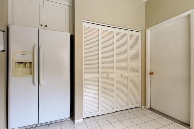11641 Branch Mooring Dr, Tampa, FL 33635 - kitchen with white refrigerator with ice dispenser and light tile patterned flooring