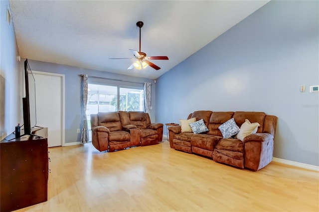 11641 Branch Mooring Dr, Tampa, FL 33635 - living area with wood finished floors, a ceiling fan, lofted ceiling, and baseboards