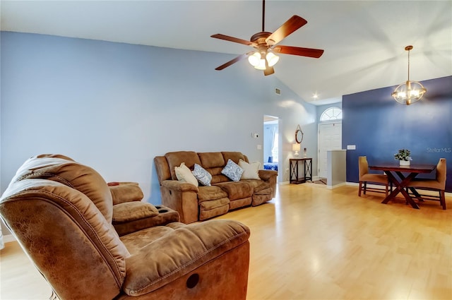 11641 Branch Mooring Dr, Tampa, FL 33635 - living area with ceiling fan, light wood finished floors, baseboards, and high vaulted ceiling