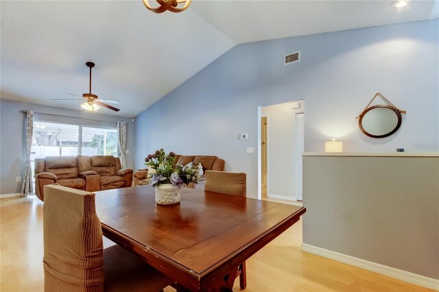 11641 Branch Mooring Dr, Tampa, FL 33635 - dining room featuring lofted ceiling, a ceiling fan, light wood-style flooring, and baseboards