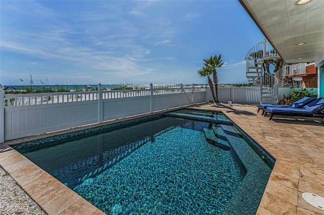 13303 Gulf Ln, Madeira Beach, FL 33708 - view of swimming pool with a fenced backyard, a pool with connected hot tub, a patio, and stairway