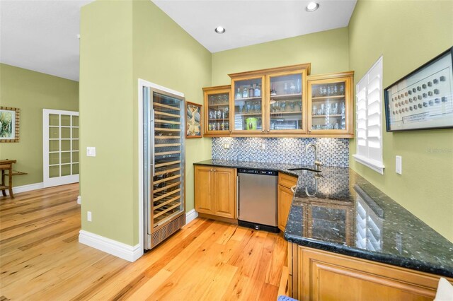 13303 Gulf Ln, Madeira Beach, FL 33708 - indoor wet bar featuring dishwasher, wine cooler, light wood-style flooring, backsplash, and recessed lighting