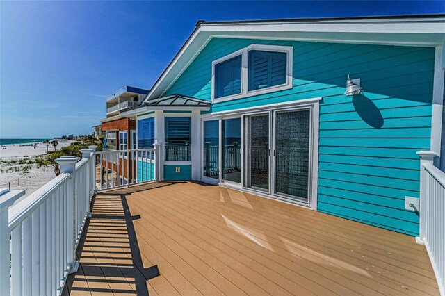13303 Gulf Ln, Madeira Beach, FL 33708 - wooden terrace featuring view of water and beach