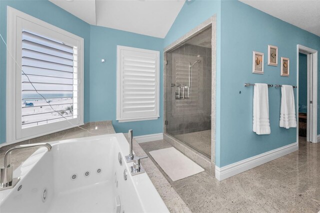 13303 Gulf Ln, Madeira Beach, FL 33708 - bathroom featuring a shower stall, baseboards, and a whirlpool tub