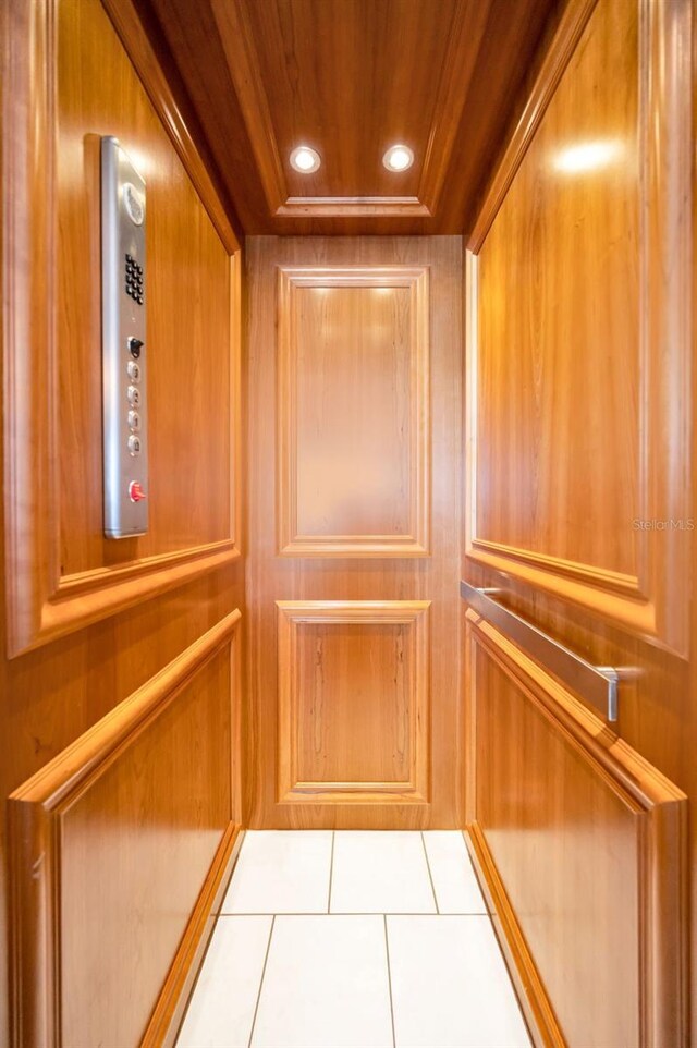 13303 Gulf Ln, Madeira Beach, FL 33708 - elevator with a raised ceiling