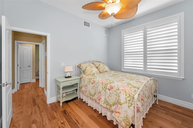 13303 Gulf Ln, Madeira Beach, FL 33708 - bedroom featuring light wood-type flooring, baseboards, and ceiling fan