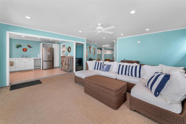 13303 Gulf Ln, Madeira Beach, FL 33708 - living room featuring crown molding, recessed lighting, ceiling fan, and light colored carpet