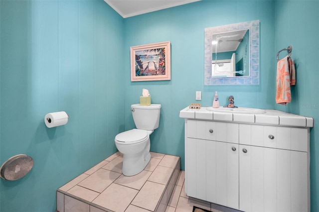 13303 Gulf Ln, Madeira Beach, FL 33708 - bathroom featuring toilet, vanity, and tile patterned floors