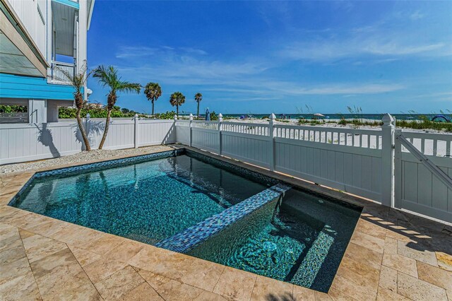 13303 Gulf Ln, Madeira Beach, FL 33708 - view of pool featuring a fenced backyard and a pool with connected hot tub