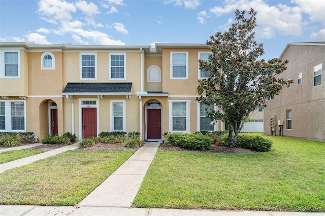 6920 Towering Spruce Dr, Riverview, FL 33578 - townhome / multi-family property with stucco siding and a front lawn