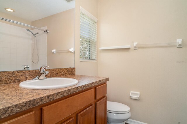 6920 Towering Spruce Dr, Riverview, FL 33578 - bathroom featuring toilet, vanity, and tiled shower